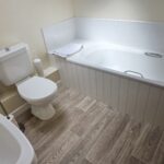 Bathroom in a Brooklands cottage apartment with a full-size bath