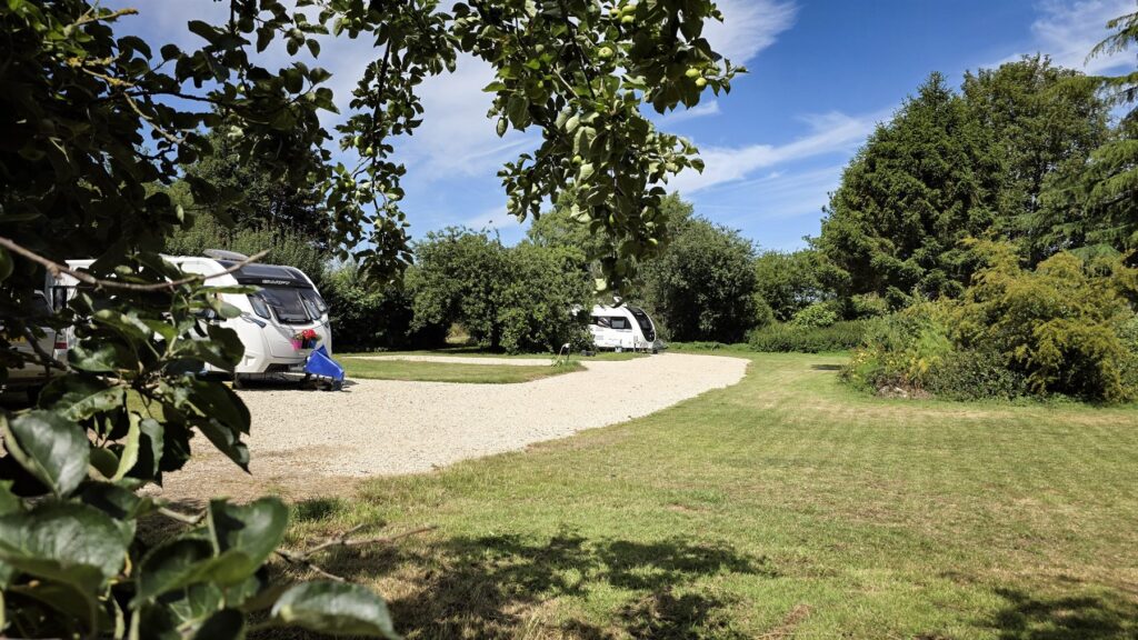 Level electric hardstanding touring pitches at Brooklands caravan park