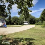 Level electric hardstanding touring pitches at Brooklands caravan park